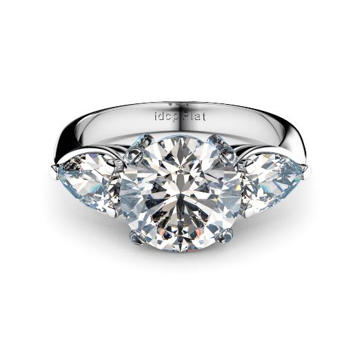 Round brilliant with pear shape diamonds three stone engagement ring